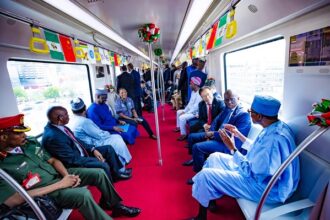 Buhari rides on Blue Lagos Rail for 9 minutes