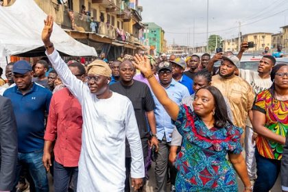 Lagos State Governor, Mr Babajide Sanwo-Oluleft and his wife, Dr Ibijoke acknowledges greetings of residents during their vote casting for the Presidential and National Assembly election, at his Polling Unit, Eiyekole Ward E3, St Stephen Primary School, Adeniji Adele, Lagos Island, on Saturday, 25 February, 2023