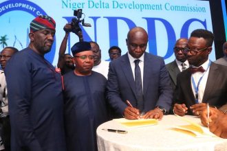 L-R: The NDDC Executive Director Projects, Mr. Charles Ogunmola; Minister of Niger Delta Affairs, Obong Umana Okon Umana; the NDDC Managing Director, Dr. Samuel Ogbuku and a representative of the United States Consulate, Mr. Chamberlain Eke; NDDC Director Legal, Dr Stephen Ighoumuaye, during the signing of MOU at the PPP, summit at the Eko Hotel and Suites, Lagos.