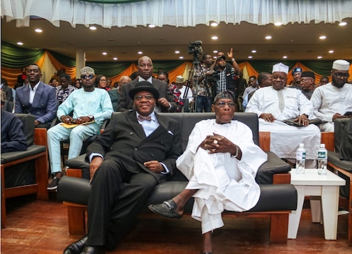 Former President of Nigeria, Chief Olusegun Obasanjo(middle) with author of the book, Mr. Tunji Olaopa during the book presentation in Abuja