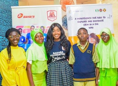 Temitope Fadodun, STEMCafe product manager; Mobo Akpene, Programs Manager, Sahara Foundation; with students from participating schools at the launch of STEAMers 2.0
