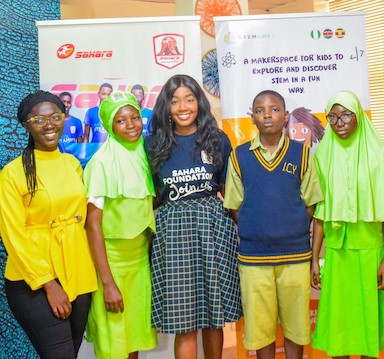 Temitope Fadodun, STEMCafe product manager; Mobo Akpene, Programs Manager, Sahara Foundation; with students from participating schools at the launch of STEAMers 2.0