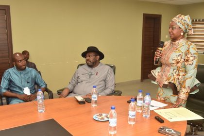 The Chairman of the NDDC Governing Board, Mrs. Lauretta Onochie, (right) speaking when she hosted members of the Niger Delta Youth Assembly at the NDDC headquarters. In the middle is the Representative of the North West on the NDDC Board, Prince Sule Iko Sami, while the President of the Niger Delta Youth Assembly, Comrade George Godwin is on the left