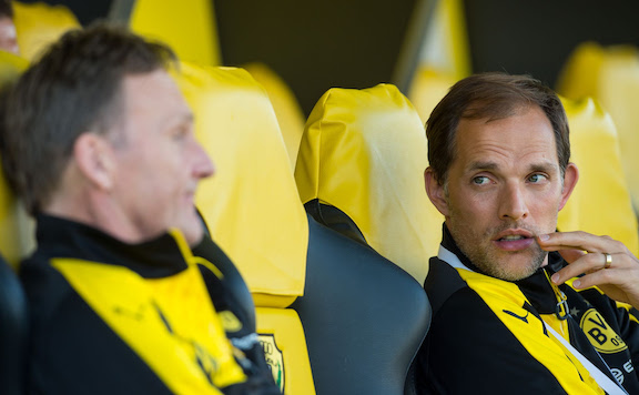 Then Dortmund's coach Thomas Tuchel (R) talks to Dortmund's CEO Hans-Joachim Watzke during the soccer test match between Jeonbuk Hyundai Motors FC and Borussia Dortmund at the Zabeel Stadium. Watzke has said that the attack with explosives on the team bus ahead of a Champions League match in 2017 was the main reason why they parted ways with coach Thomas Tuchel at the end of the season. Photo: picture alliance / Guido Kirchner/dpa