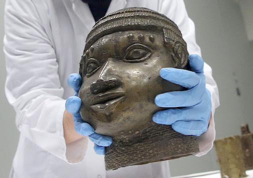 A museum employee packs one of the Benin bronzes assembled for return to Nigeria in December 2022. Photo: Wolfgang Kumm/dpa