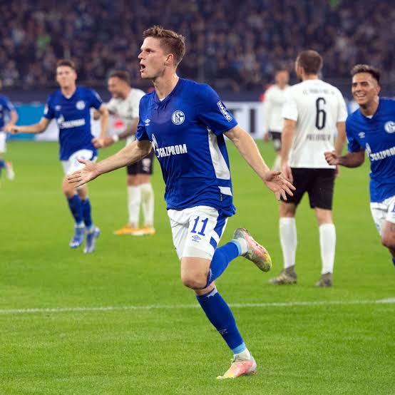 Schalke's Marius Butler on the run after scoring a goal in the crucial encounter in the Bundesliga