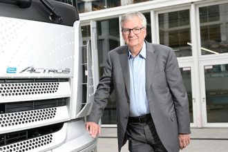 Martin Daum, the CEO of commercial vehicle manufacturer Daimler Truck, stands in front of an eActros truck at the company's headquarters near Stuttgart. Photo: Bernd Weißbrod/dpa