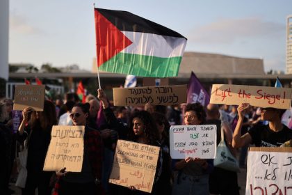 Demonstrators hold placards and a Palestinian flag during a demonstration against Israeli army operations in Gaza. Despite intensive efforts to reach a ceasefire, there is no end in sight to the recent fighting in the Middle East. Photo: Ilia Yefimovich/dpa