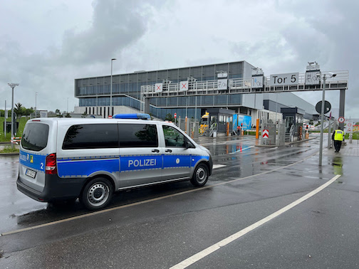 A police emergency vehicle is parked at a Mercedes-Benz plant. Photo: Julian Rettig/dpa