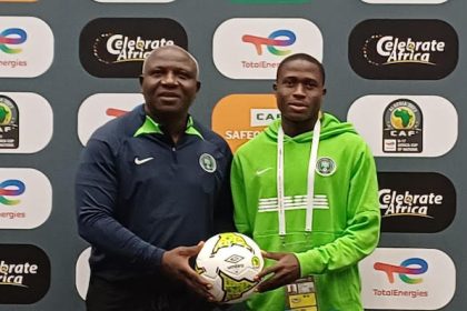 Coach Ugbade (left) with defender Emmanuel Michael at the press conference in Algiers on Wednesday