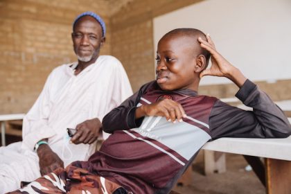 Daouda, with his father, Hamady with sigh of relief after the successful surgery by a team of surgeons assembled by Mercy Ships