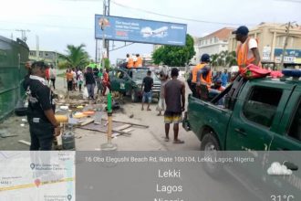 LAWMA men at work on the Lekki Epe Expressway clearing the area of shanties and street trading
