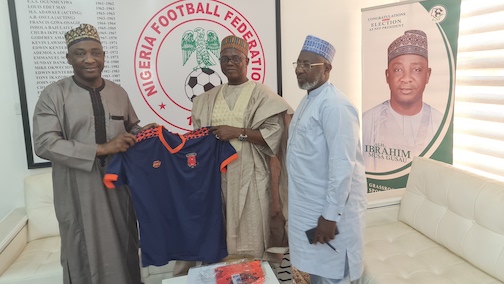 Lulu (middle) presenting a FOSLA shirt to Gusau (left) with Sanusi on the right