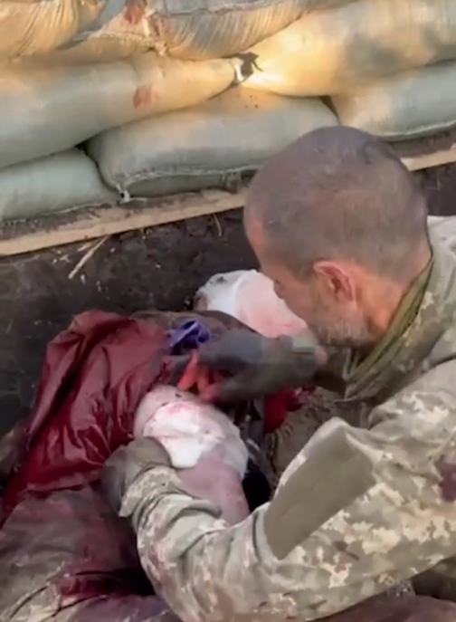 Head of Ukrainian Platoon wounded in the battle field on Orekhov receiving medical care from Russian soldiers
