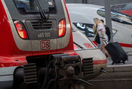 Train passengers walk past Deutsche Bahn trains at Munich Central Station. The German national rail service, Deutsche Bahn (DB), will be using artificial intelligence (AI) applications in freight transport throughout Germany, a railway spokeswoman said on Wednesday. Photo: Peter Kneffel/dpa