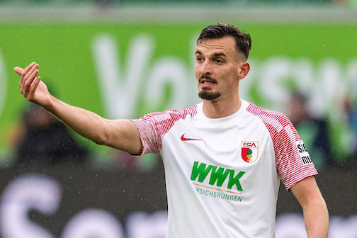 Augsburg's Mergim Berisha gestures during the German Bundesliga soccer match between VfL Wolfsburg and FC Augsburg at the Volkswagen Arena. Augsburg have signed Germany forward Mergim Berisha on a permanent transfer from Turkey's Fenerbahce but that doesn't guarantee that he will also stay. Photo: David Inderlied/dpa