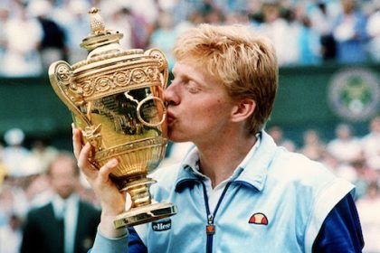 Boris Becker caresses the trophy of his Wimbledon championship