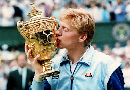 Boris Becker caresses the trophy of his Wimbledon championship