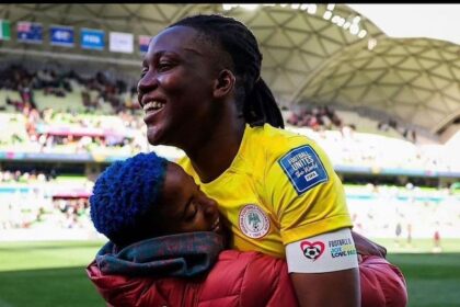 Girl With The Blue Hair: Rasheedat Ajibade hugs Nnadozie, the game’s MVP.