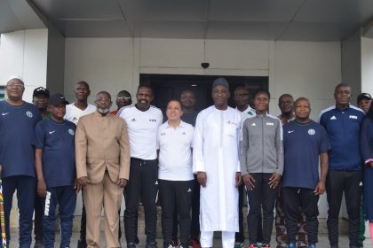 NFF President Gusau and GS Sanusi in a group photograph with the instructors and members of the NFF Referees Committee at the NFF Secretariat on Monday.