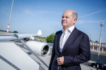 German Chancellor Olaf Scholz boards the Air Force Airbus at the military section of BER Berlin-Brandenburg Airport for the flight to Lithuania for the NATO summit in Vilnius. Photo: Kay Nietfeld/dpa