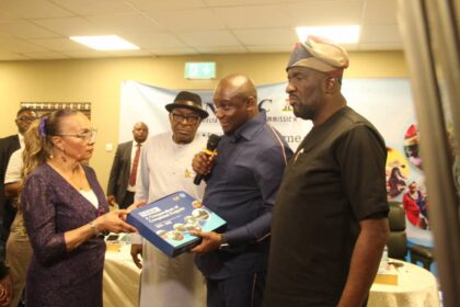 The NDDC Managing Director, Dr Samuel Ogbuku,(2nd right) presenting a compendium of the Commission's projects to Niger Delta women leader and activist, Lady Ankio-Briggs, (left) during an interactive meeting with Women Leaders of Ethnic Nationalities and key stakeholders in the Niger Delta region at the NDDC headquarters in Port Harcourt. Second left is NDDC Executive Director, Finance and Administration, Major General Charles Airhiavbere(Rtd), while the Executive Director, Projects, Mr. Charles Ogunmola is on the right