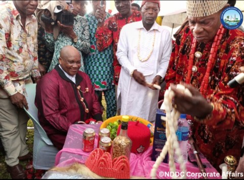 The Representative of Abia State on the NDDC Governing Board, Chief Eruba Dimgba (sitting), receiving a chieftaincy title from the Chairman of Ukwa West Traditional Rulers Council, Eze Chinyere Dike during a reception organised in his honour by the people of Asa community at the Ogwe Central School, Asa.