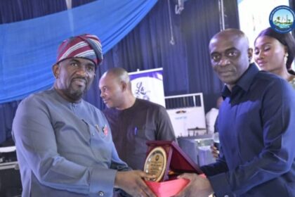 The Chairman of the NDDC Governing Board, Mr. Chiedu Ebie (right), presenting a plaque to the former Executive Director, Projects, Mr. Charles Ogunmola, during a send-off party for the immediate top management staff of the Commission in Port Harcourt.