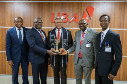 Executive Director, United Bank for Africa(UBA) and alumnus, University of Ibadan(UI), Mr. Ugochukwu Nwaghodoh; Registrar, University of Ibadan, Mr. Ganiyu Oke Saliu; Group Managing Director/CEO, United Bank for Africa, Oliver Alawuba; Vice Chancellor, University of Ibadan, Professor Kayode Adebowale; and Deputy Vice Chancellor, Administration and Chairman UI @ 75, Professor Peter Olapegba, during the conferment of UI @ 75 Ambassador on Alawuba, an Alumnus during the visit of the University’s management to UBA House, Marina on Thursday.