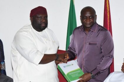 The NDDC Managing Director, Dr Samuel Ogbuku (right), presenting the 2024 budget proposal to the Chairman of the Senate Committee on NDDC, Senator Asuquo Ekpeyong (left), at the National Assembly.