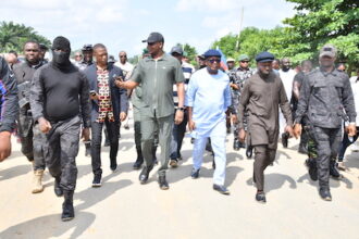 The NDDC Managing Director, Dr Samuel Ogbuku, (middle) and the Executive Director, Projects, Sir Victor Antai (3rd right), inspecting the failed sections of the East-West Road Ula-Okobo town in Ahoada West Local Government Area of Rivers State