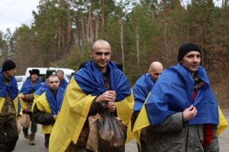 Captured Ukrainian soldiers return home following exchange deal with Russia