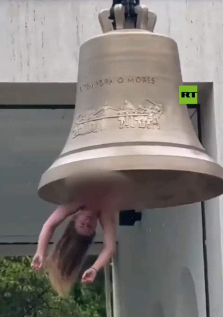 BELLES AND BELLS! Naked Artist Swings from Church Tower as Human Clapper in Bizarre ‘Art’ Show BELLES AND BELLS! Naked Artist Swings from Church Tower as Human Clapper in Bizarre ‘Art’ Show